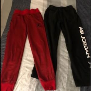 Two pairs of kids size large Jordan sweatpants